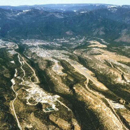 Southwest aerial view of Los Alamos National Laboratory, left, and Los Alamos, middle and right, 2006. Courtesy of LANL.
