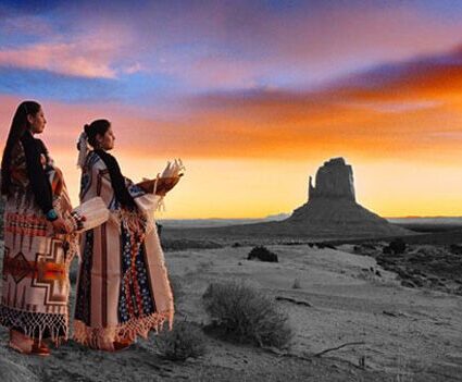 Women dressed in traditional attire praying to the rising sun. Photo: Facerock Productions.