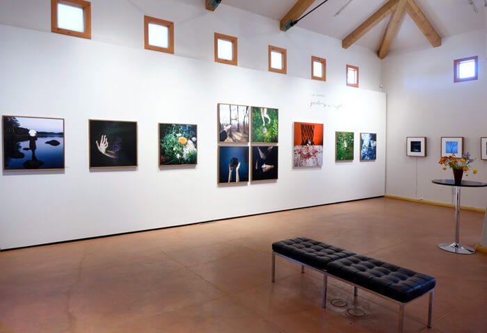 interior of Photo-eye Gallery with photographs hanging.