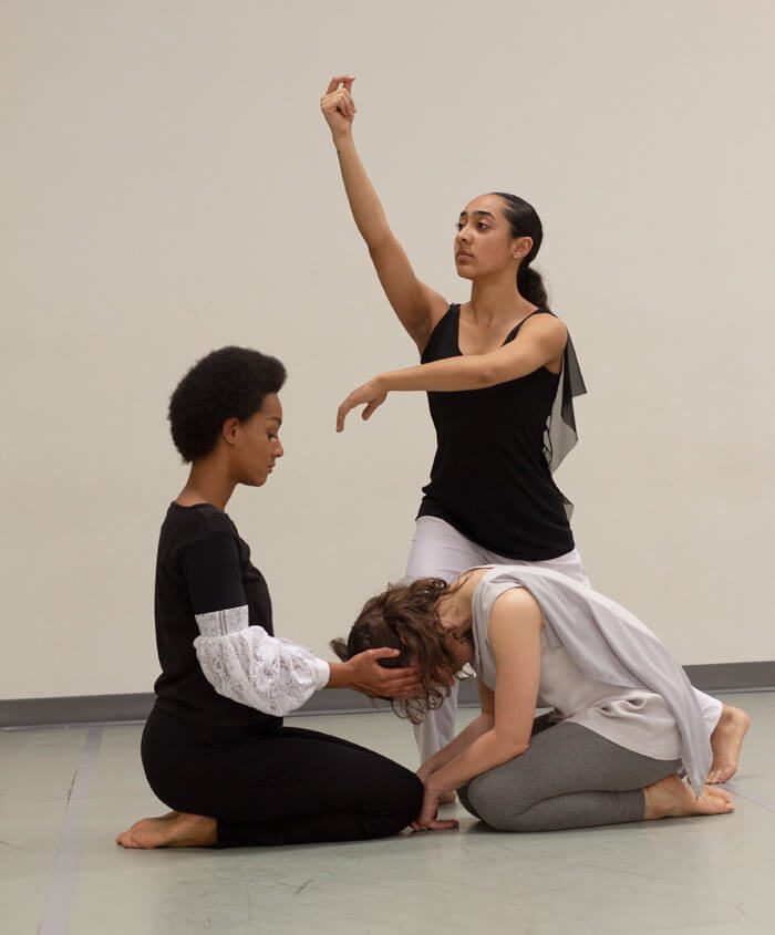 Three dancers in Keshet Dance Company's Movement for Mercy performance