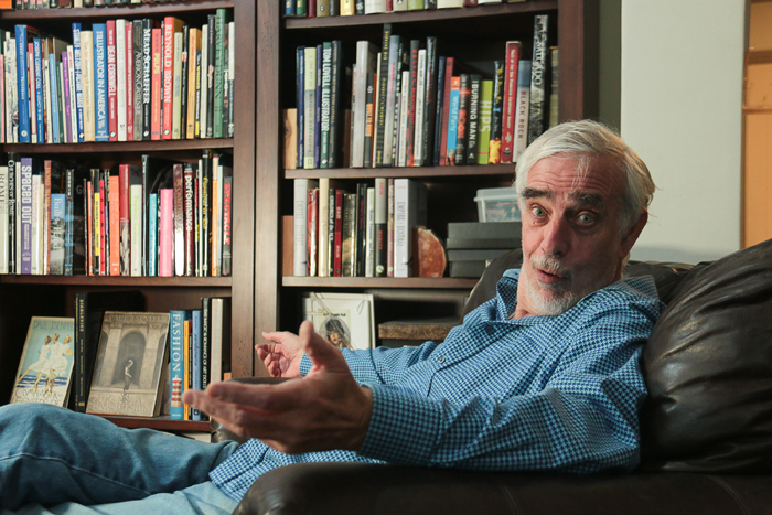 Anthony Bondi in front of books