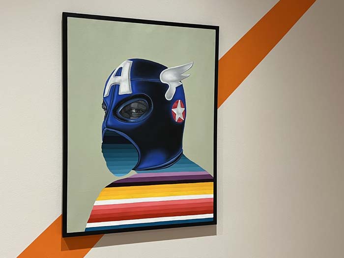 Alejandro Macias' Under the Mask depicts the artist wearing an ill-fitting Captain America mask in luchador style