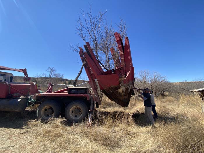 A tree spade removing a honey mesquite from ranchland in Yellowhouse Canyon, TX. 