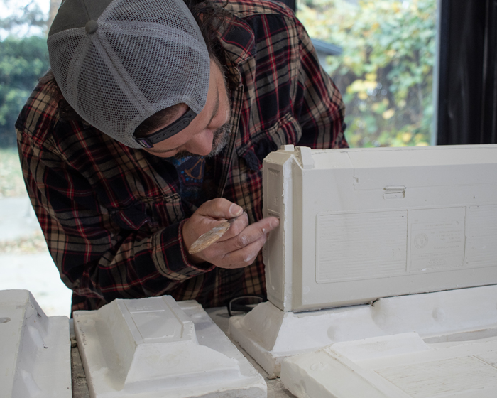 Horacio Rodriguez works on the cast porcelain boombox