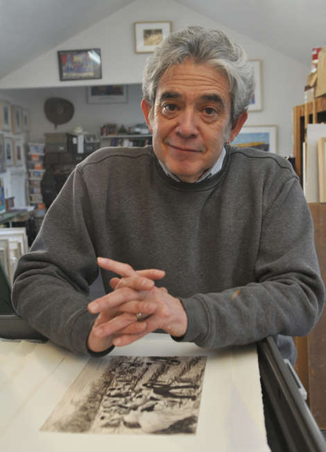 Tony Ortega seated in his studio