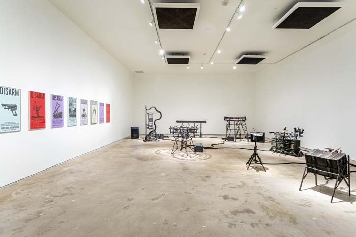 Installation view of artwork by Pedro Reyes, with sonic sculptures built from repurposed firearms.