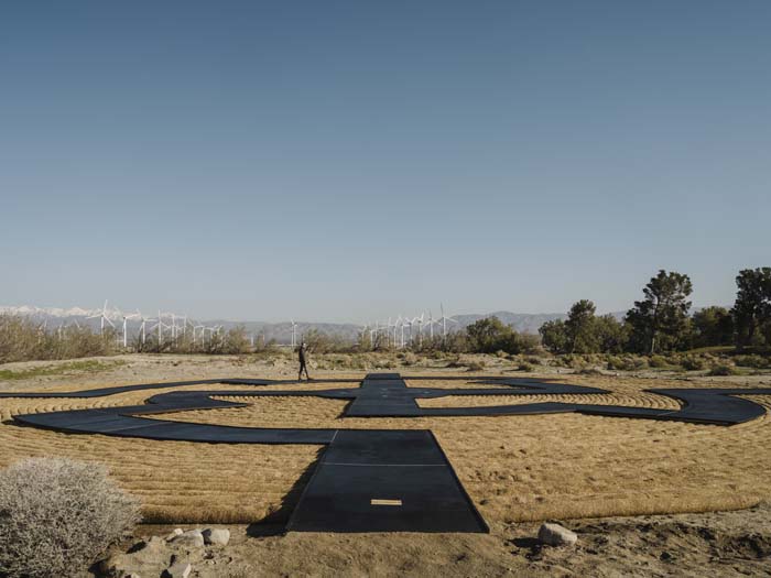 Installation for Desert X 2023 by Gerald Clarke (Cahuilla), which wove together rows of hay in a maze-like design.