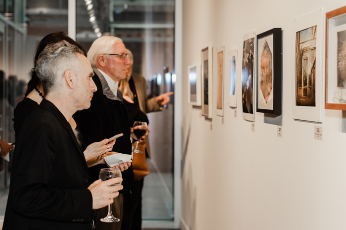 Colorado Photographic Arts Center visitors look at artwork