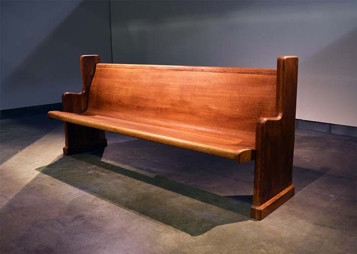 Installation by Benjamin Winans of a found church pew