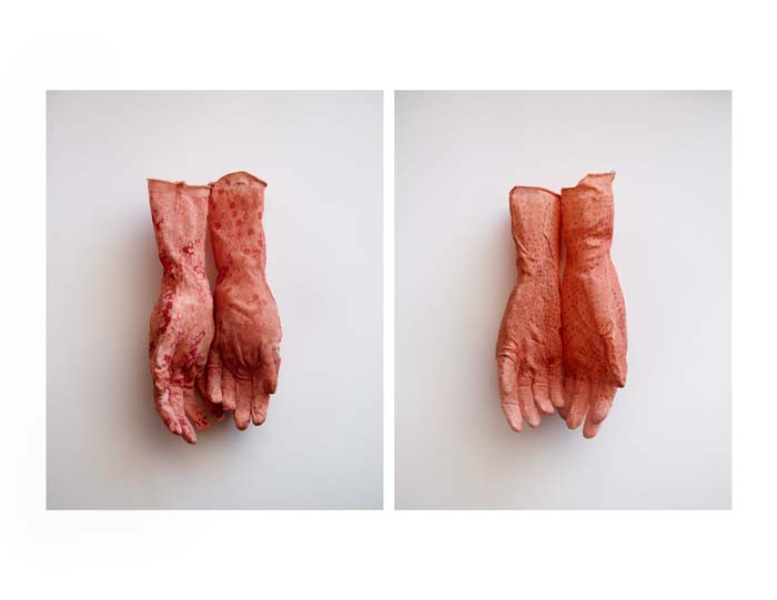 Two pairs of latex gloves that appear like naturalistic hands, by artist Jennifer Thoreson