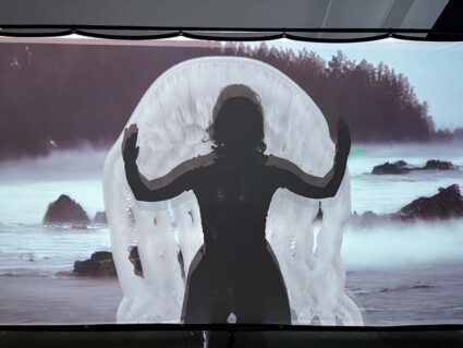 Silhouette of a figure with outstretched arms over an AI-generated landscape of a shoreline and dark forest, with an ambiguous floating white shape in the center, framing the figure.