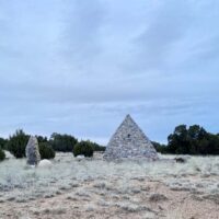 Stones arranged in a pyramid in the New Mexico landscape