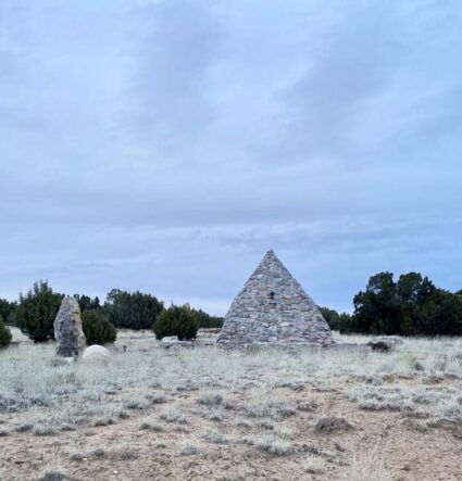 Stones arranged in a pyramid in the New Mexico landscape