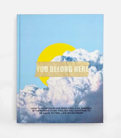 Book cover with the title "You Belong Here" over a cloud obscuring a yellow orb on a sky blue background.