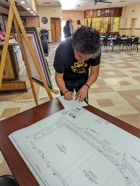 An artist registers for a La Flor Del Pueblo Phoenix open house