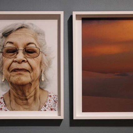 Photographic diptych with a woman with white hair and her eyes closed on the left, and sand dunes in orange light on the right.