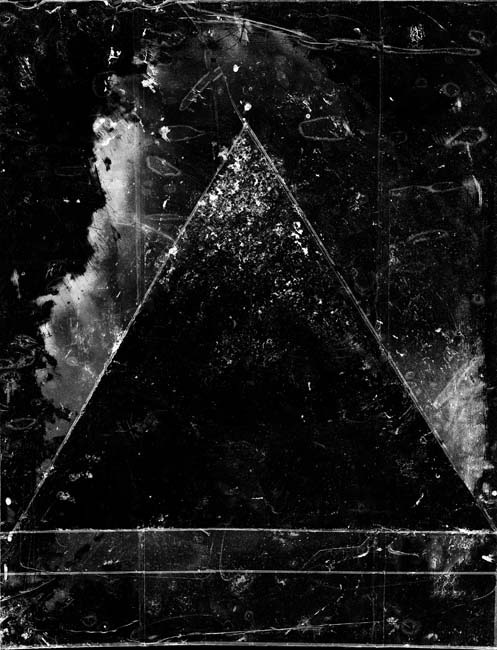 Black and white photogram of a black triangle with scratches.