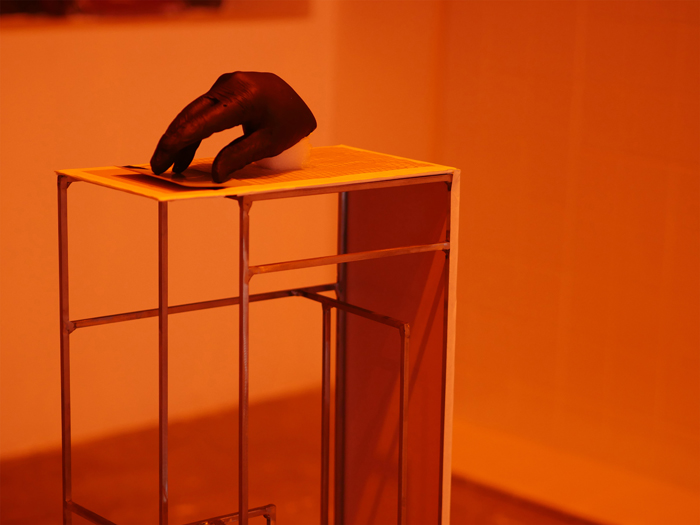 alejandro t. acierto, Study table sculpture of a plaster-cast hand on a pedestal