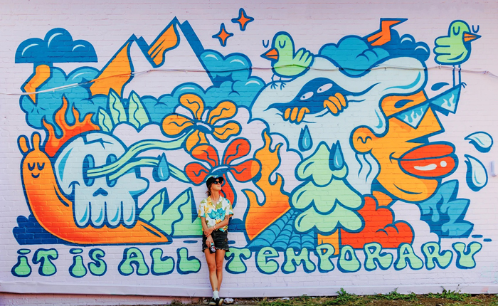 Hannah Eddy in front of her 2023 mural It's All Temporary in Oklahoma City