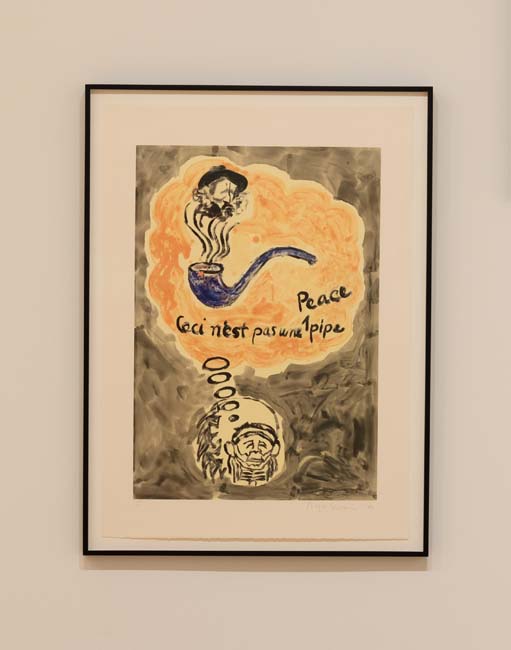 Monotype reading Ceci n'est pas une peace pipe, with a blue pipe and an image of General Custer coming out of the smoke.