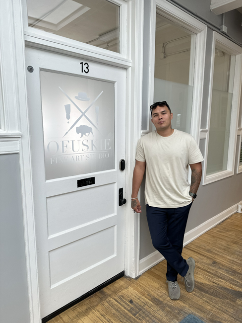 George Alexander in front of his Ofuskie studio