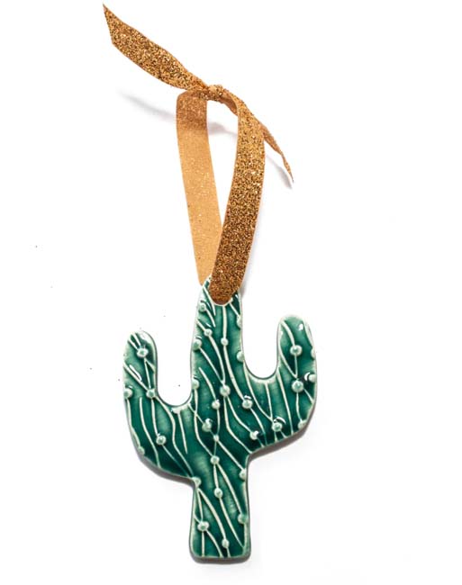 Ceramic saguaro cactus hanging ornament with a gold ribbon.