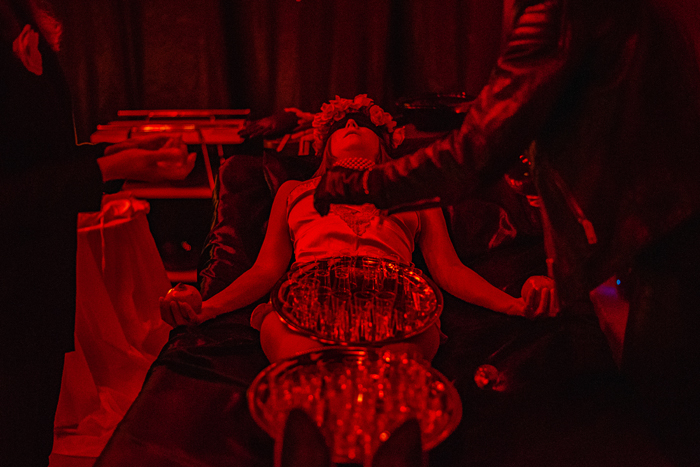 Black Mass Blood Ritual performance still of a person receiving a ritual