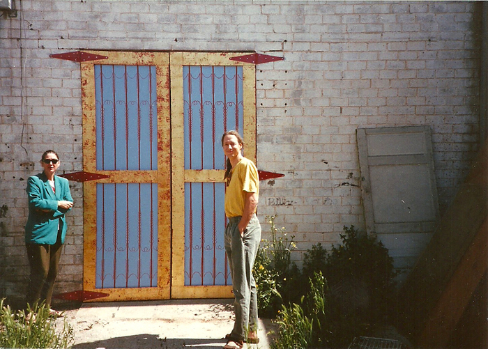Beatrice Moore and Tony Zahn at 1025 Grand Avenue in 1992 stand next to the back door Zahn painted