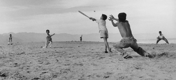 Manuel Carrillo, Untitled photo of kids playing baseball, 1960, gelatin silver print