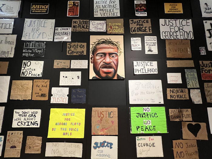 George Floyd exhibition at ASU Art Museum shows a portrait of George Floyd among other signs