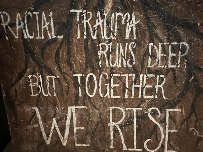 George Floyd exhibition at ASU Art Museum include an artwork that reads "Racial Trauma Runs Deep But Together We Rise."