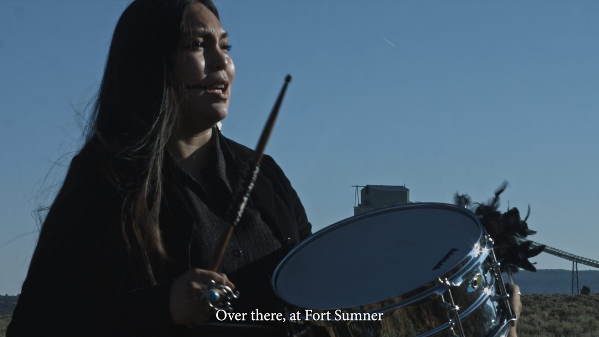 Raven Chacon, Three Songs at the Harwood Museum of Art, video still of Sage Bond singing the translated words "Over there, at Fort Sumner" 