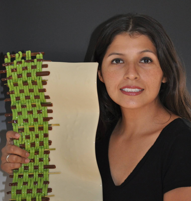 Perla Segovia holds a piece of woven glass