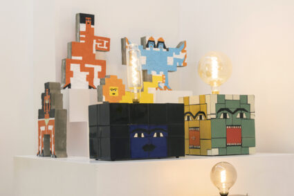 Esther Elia Deity lamp installation, showcasing block-faced lamps made with colorful ceramic tiles.