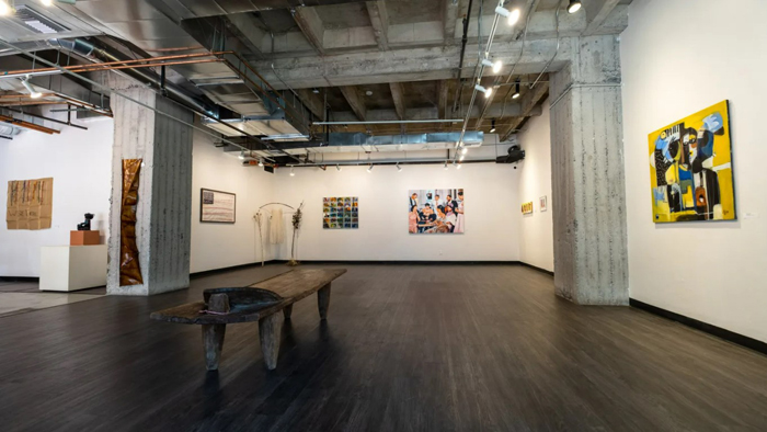 Artworks hangs inside of a gallery at Blue Lotus Artists’ Collective