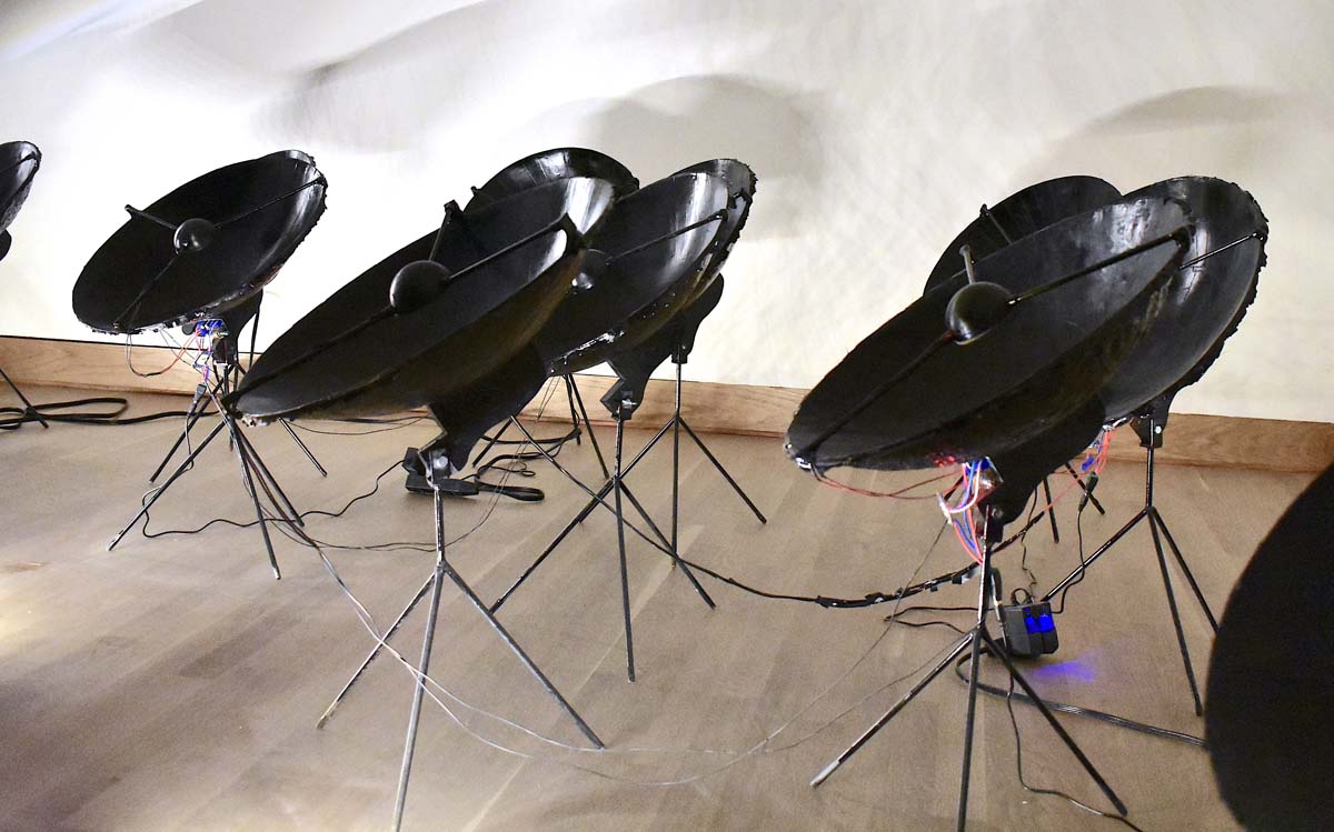 ann haeyoung's an array, an installation of black satellite dishes on tripods.