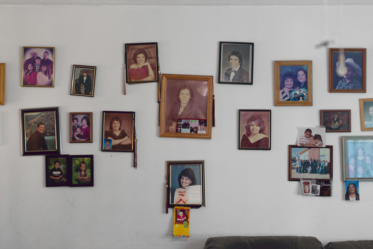 A photo by Sofie Hecht of family photographs on a wall