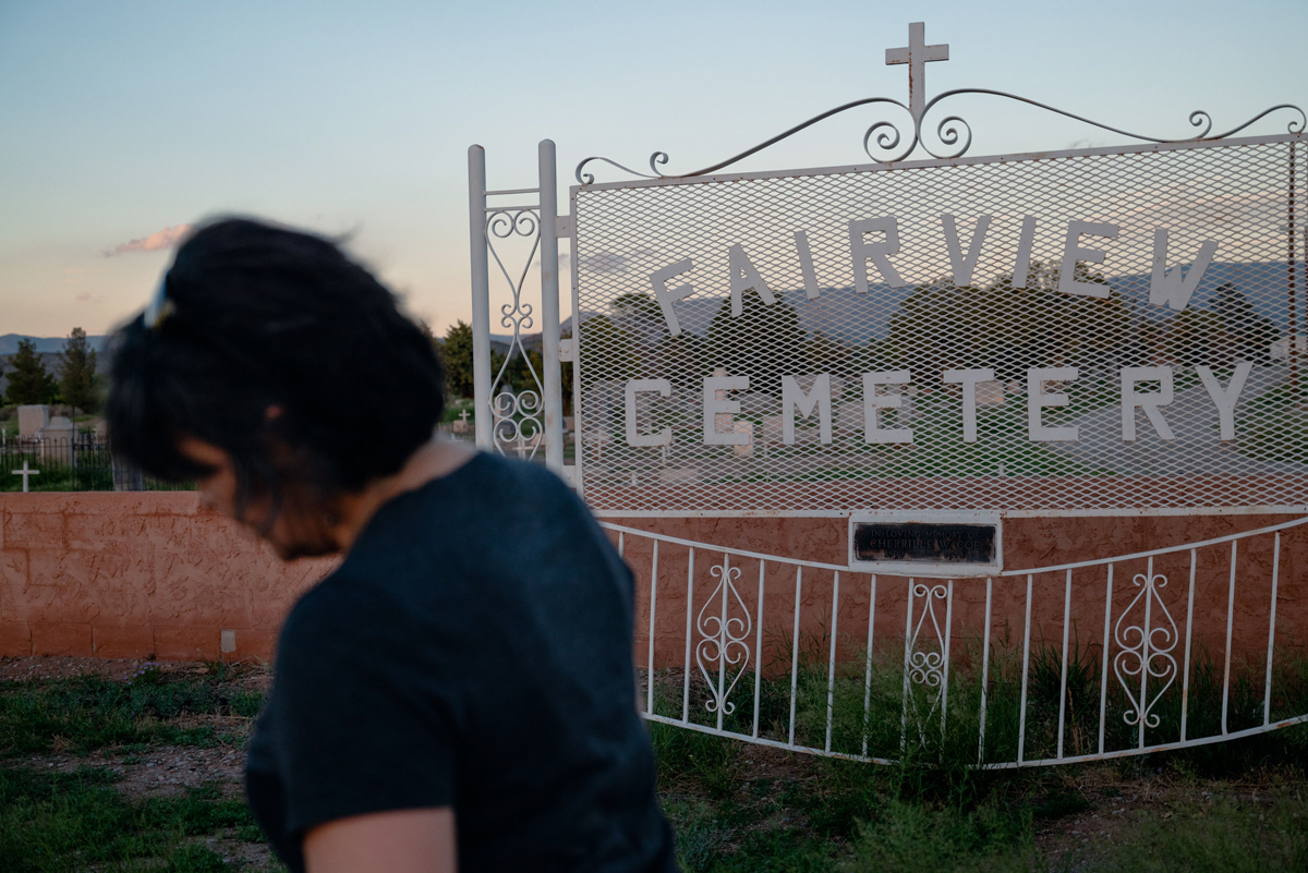 A photo by Sofie Hecht of Andrea Carrillo by the Fairview Cemetery in Tularosa, New Mexico