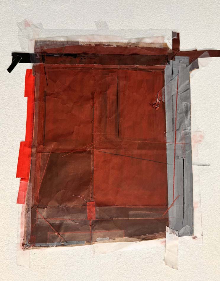 An abstract collage of red and brown and gray paper affixed by strips of tape.