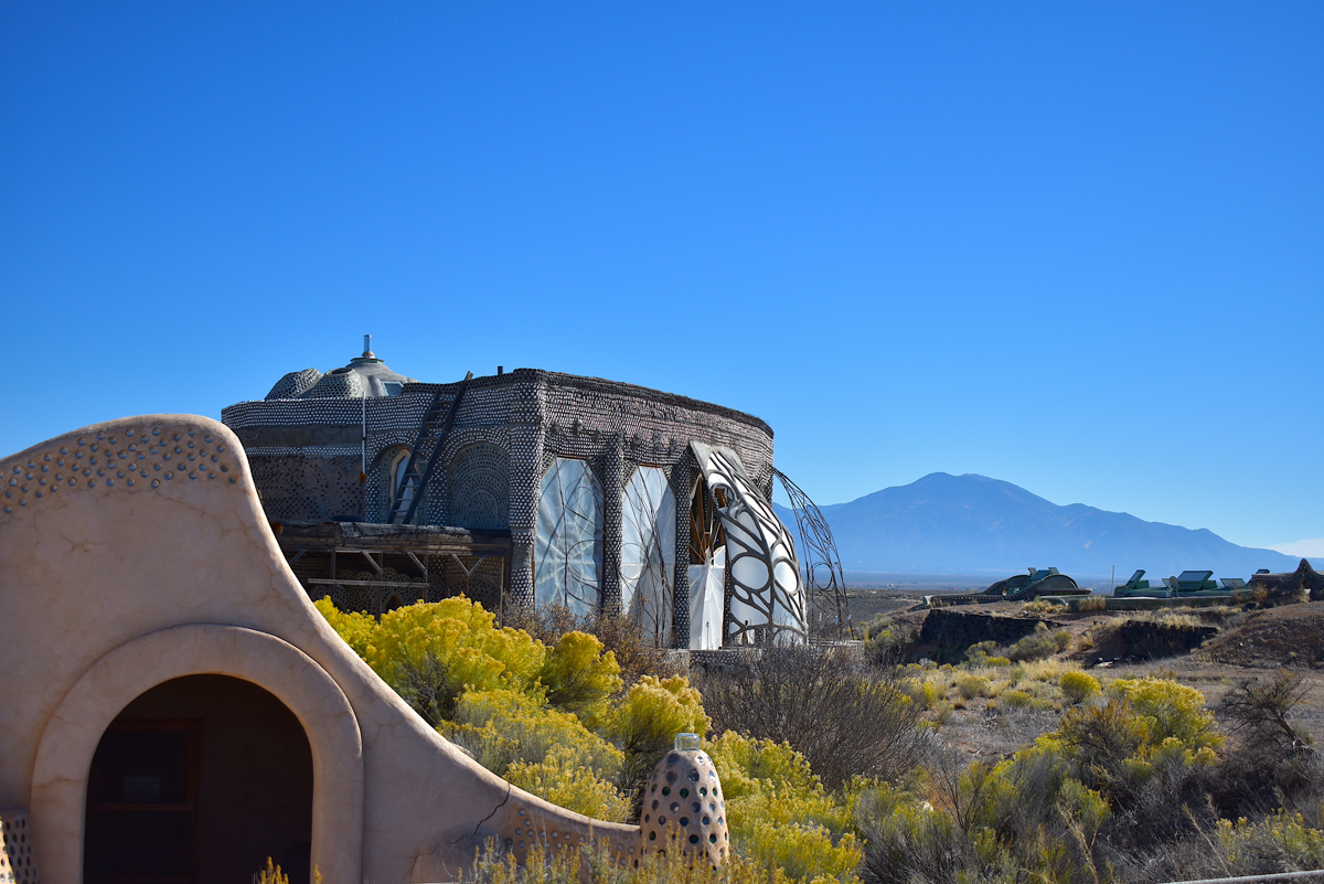 Image of an earthship on a mesa outside Taos, one of several New Mexico roadside attractions featured in this article.