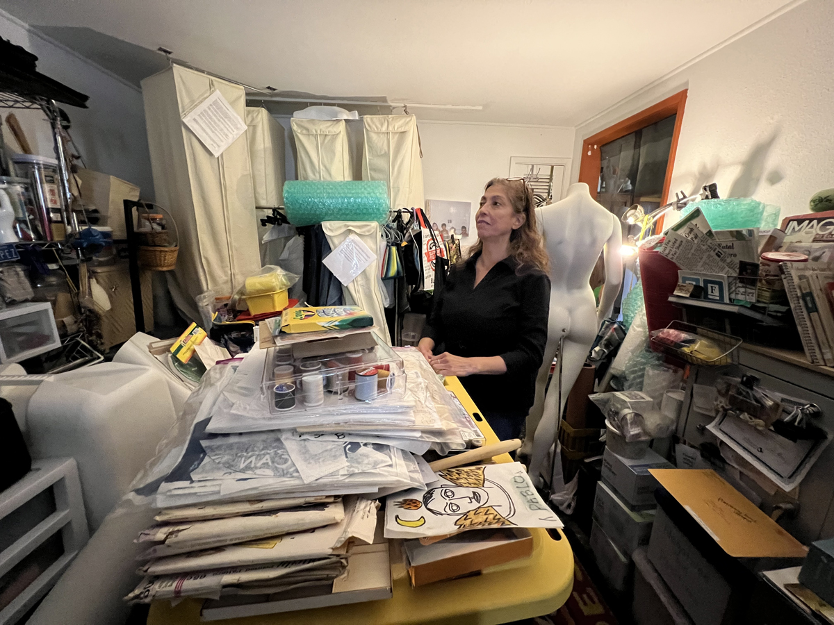 Phoenix-based artist Annie Lopez surveys her small studio, which is packed with raw materials and artistic output.