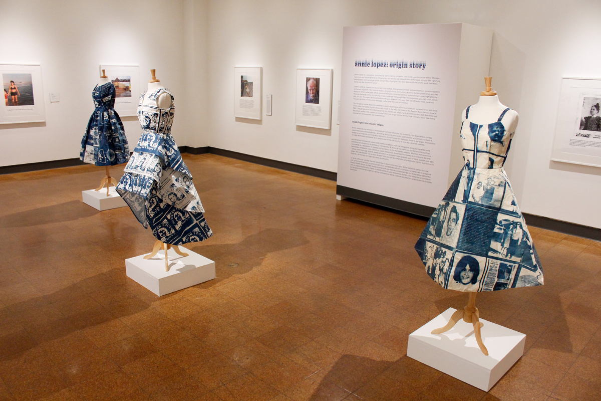 An installation view of Annie Lopez's solo exhibition Origin Story, featuring three cyanotype dress forms on mannequins.