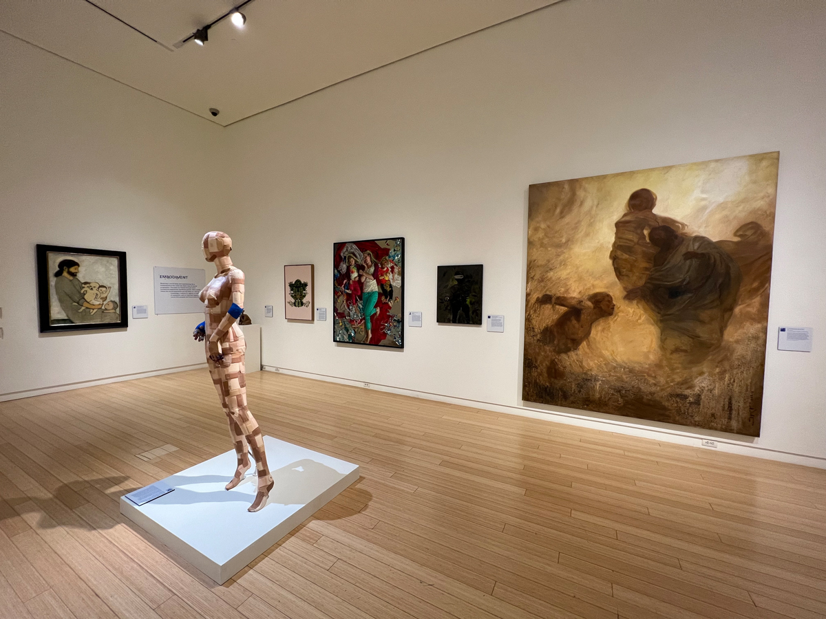 Installation view of Materializing Mormonism at Mesa Art Center shows artworks of various mediums in a gallery space. The show examines Mormonism in Arizona through an artistic lens.