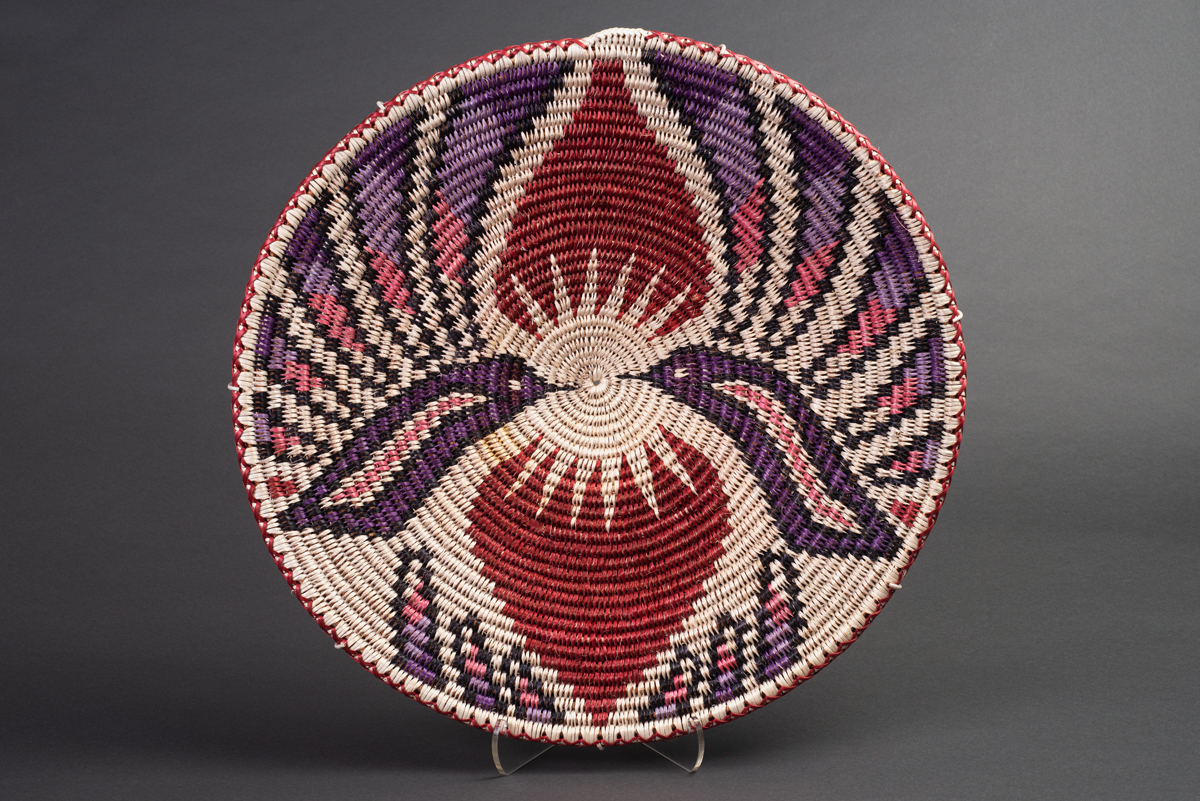 An Indigenous basket with a double hummingbird motif. This image is featured in Woven from the Center, a new book on Native basketry by Diane Dittemore.