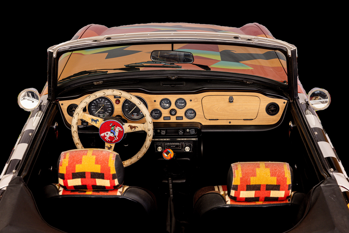 The interior of a Triumph convertible decked out in Native American motifs by ten Indigenous artists.