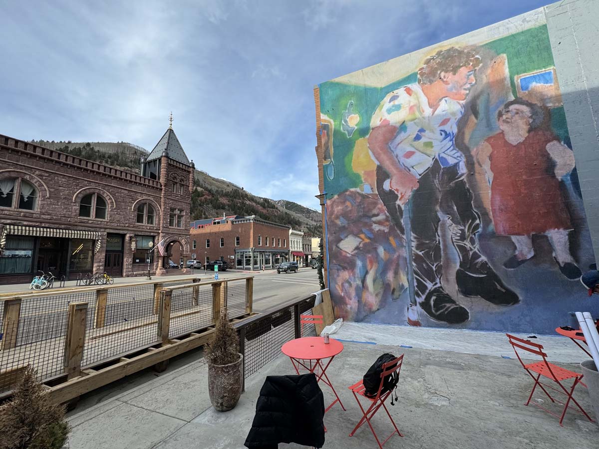 Pamela Zoline’s mural depicting <i>A Jewish Giant at Home with his Parents in the Bronx, New York</i> (1970) after Diane Arbus, for the Telluride Mountainfilm Festival. 