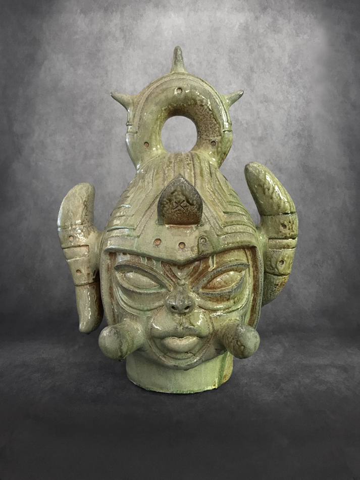 Stylized, light green ceramic bust of a futuristic Native warrior by Virgil Ortiz, one of many Indigenous artists exhibiting in conjunction with this year's Santa Fe Indian Market.