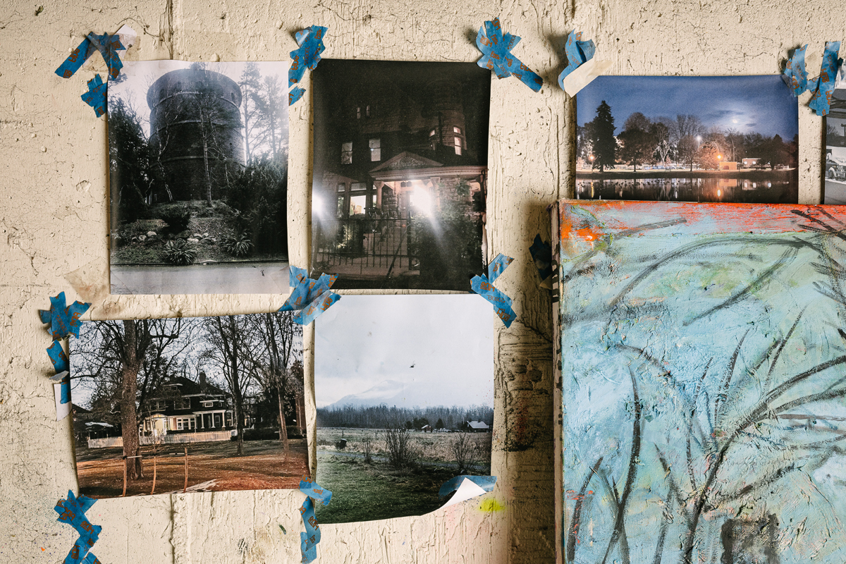 Photographs taped to the wall in Lydia Farrell's studio.