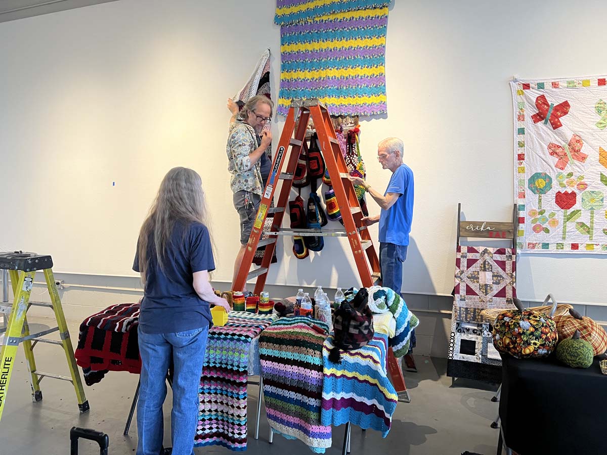 Artists installing the <i>Madres Radicales</i> exhibition at 5&J Gallery, 2024