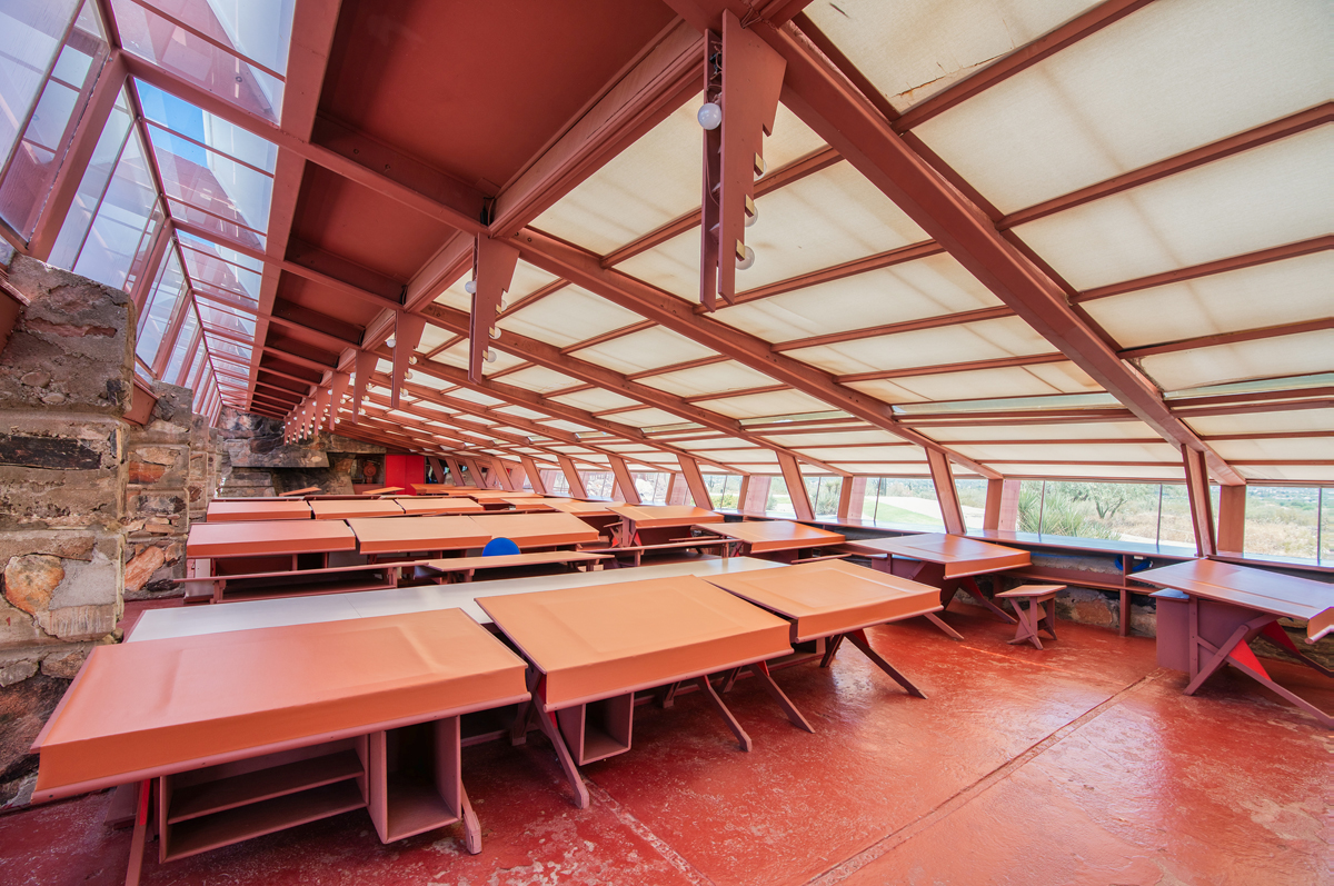 Drafting tables beneath a paneled canvas ceiling in the Arizona studio of Frank Lloyd Wright.